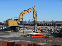 April 2014 - Contractor breaks up concrete slab prior to excavation along Kellogg St.