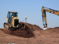 April 2016 - Grading cover soils on SA-6 south cap