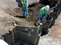 August 2015 - Trimming top elevation of barrier wall at Kellogg Street properties