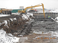 December 2013 - Contractor cleans excavation floor with longstick excavator