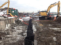 February 2014 - Barrier wall installation progress on Kellogg Street properties looking east