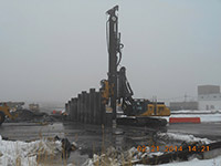 February 2014 - Equipment installs barrier wall on Kellogg Street properties