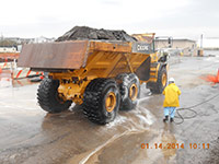 Janurary 2014 - A worker washes truck tires