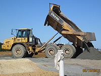 June 2016 - Unloading clean imported stone screening in utility corridor