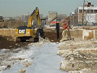 March 2015 - Breaking up concrete for sheet pile installation