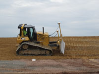 May 2016 - Grading and compacting cover soils along open space area