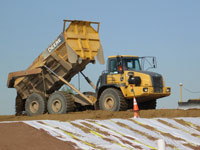 May 2016 - Unloading imported cover soils for placement in open space area